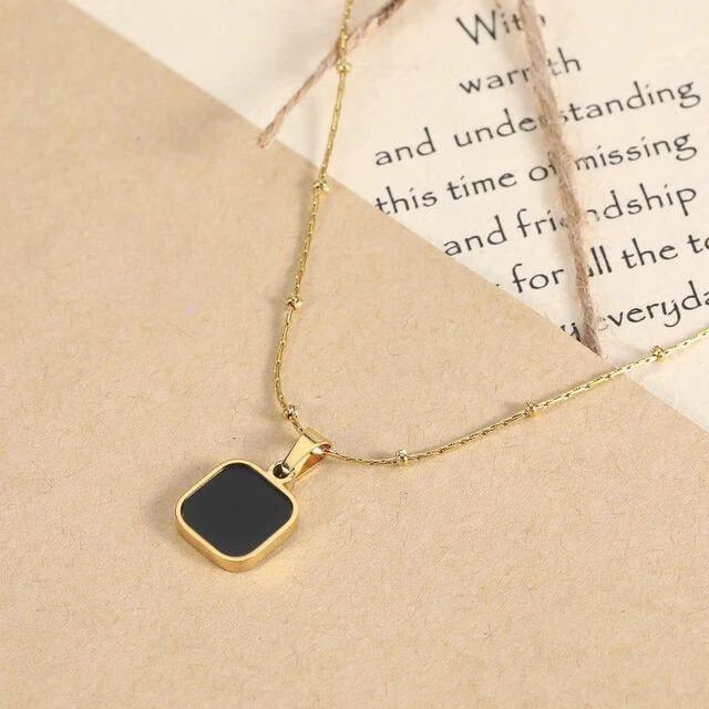 A very thin stainless necklace with a different black color that suits all times