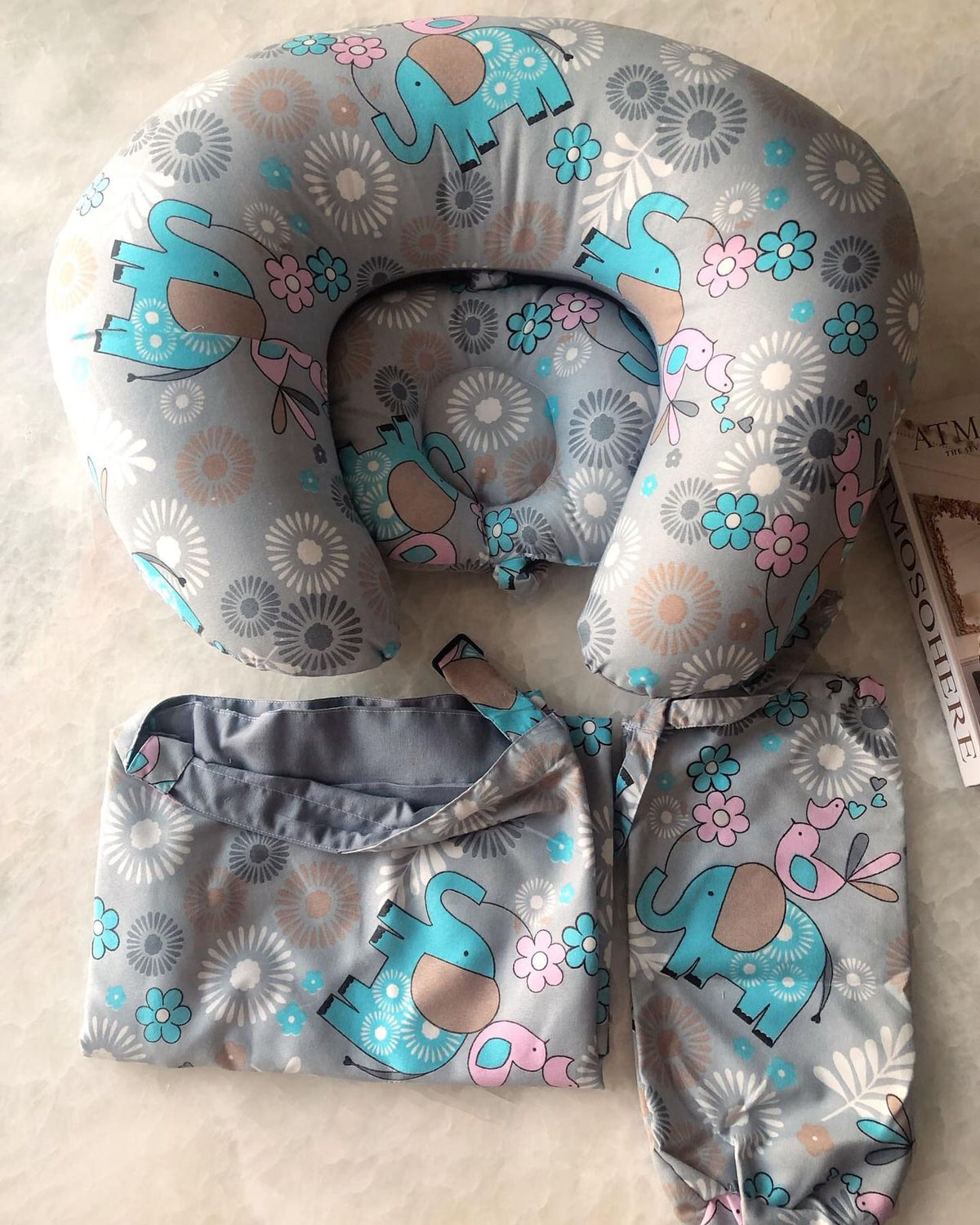 A set consisting of a breastfeeding cover + a breastfeeding pillow with an elephant design